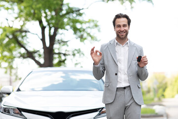 Great choice, salesman giving car key to customer, expert advice on renting and buying auto.