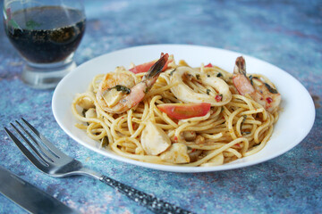 plate of sea food pasta on table 