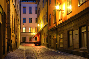 Fototapeta na wymiar Empty street with no people in Stockholm old city at evening time