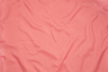 Pastel Pink color silk crumpled linens sheet background.