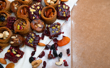 Dried fruits baklava and Turkish delight with pistachios and nuts, close-up view .