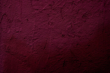 Crimson colored wall background with textures of different shades of crimson red