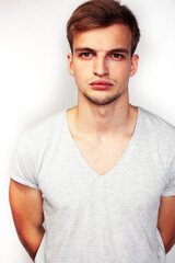 Obraz premium young handsome teenage hipster guy posing emotional, happy smiling against white background isolated, lifestyle people concept