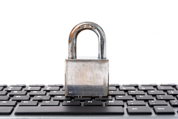 Padlock on keyboard in white background for computer internet security concept.