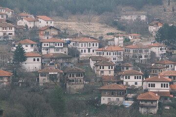 Fototapeta na wymiar UNESCO world heritage protection houses in Safranbolu during winter. Houses in foggy and rainy day.
