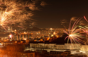 Fireworks in the city at night during New Year celebration. Soft focus background