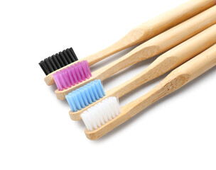 Bamboo toothbrushes on white background