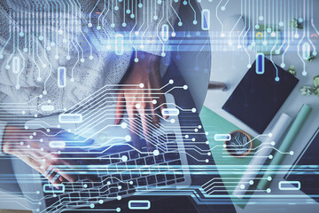 Double exposure of woman hands working on computer and data theme hologram drawing. Top View. Technology concept.