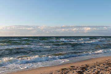 Fototapeta na wymiar Scenic beach scene with waves at the oceanfront. 