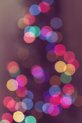 Vertical colorful multicolor bokeh background of christmas tree