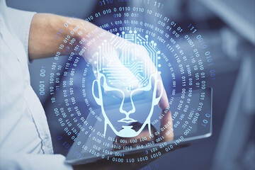 Double exposure of man's hand holding and using a digital device and brain hologram drawing. Data concept.