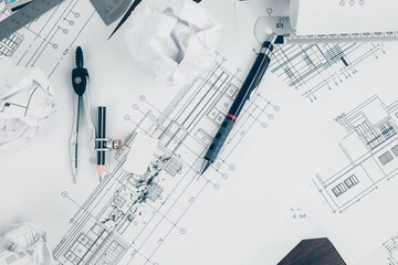 eraser crumbs, compass and pencil  on drawing design working on bueprint. House planning design and construction concept.