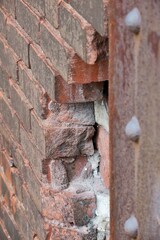 broken bricks at industrial factory wall