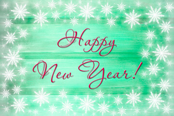 Winter wooden green mint nature background with snowflakes around. Texture of painted wood horizontal boards. Happy New Year card.