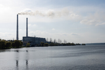 Obraz premium Panoramic view of power station Lukomlskaya Gres. Chimneys with smoke of power plant. Ecological problem. Environmental pollution concept.
