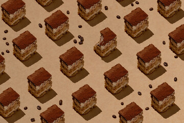 Vegan Tiramisu with coffee beans on the background. Pattern.