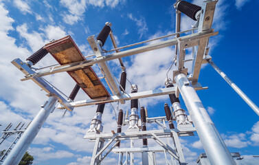 Construction of a power transmission substation on a background of blue sky