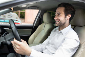 Positive facial expression of driver while driving in own transport