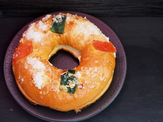 Roscon de reyes with cream and christmas ornaments