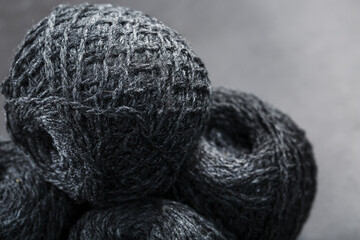 Tangles of gray yarn made of natural wool close-up