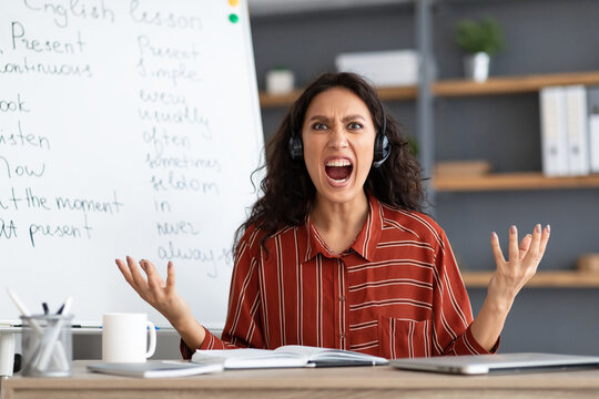 Angry And Tired Teacher Having Online Lesson