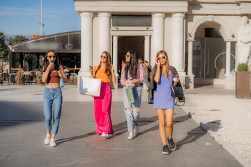 Fototapeta premium Beautiful girls are walking with their sunglsess on them