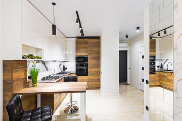Modern wooden kitchen in a small apartment, apartment interior