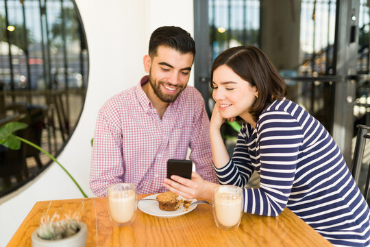 Couple using the phone during a date
