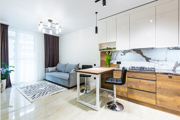 Modern wooden kitchen in a small apartment, apartment interior