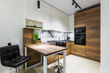 Modern wooden kitchen in a small apartment, apartment interior