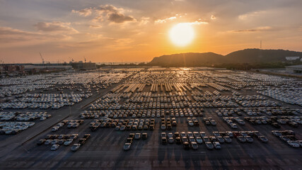 Aerial view a lot of new car for import and export shipping by ship , Smart dealership at car depot. © Yellow Boat