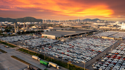 Aerial view a lot of new car for import and export shipping by ship , Smart dealership at car depot , New car at car factory