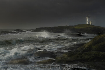Fototapeta na wymiar A view Elie lighthouse, Fife Scotland with coastline.