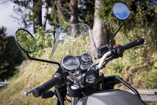 Closeup of Royal Enfield Himalayan motorcycle handlebar and cockpit 
