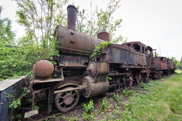 Old and rusty steam locomotive abandoned on an lost place train station in Austria