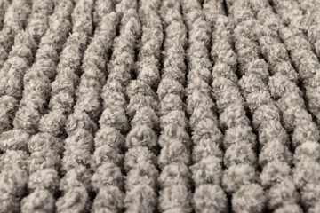 Gray chenille soft bath mat texture background. Bath Accessories. Top view.