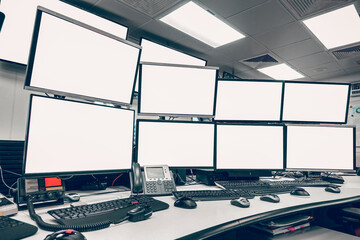 group of blank monitors and screen on security desk or control room for monitor process or stock data trading