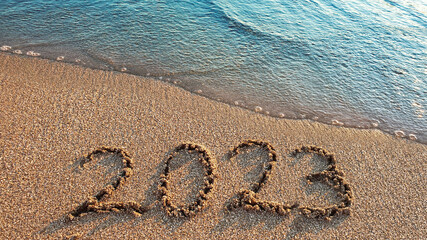 New Year 2023 is coming concept on tropical beach.