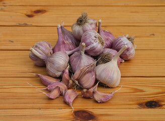 A Heap of garlics on a wooden background
