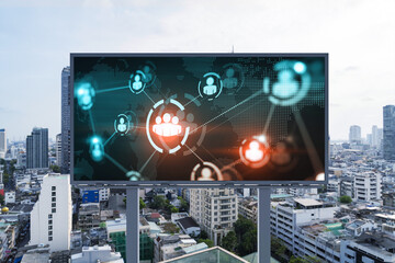 World planet Earth map hologram and social media icons on billboard over panorama city view of Bangkok, Southeast Asia. The concept of people networking and connections.
