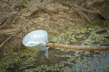 Ground watering cans are used in agricultural gardens in Thailand.