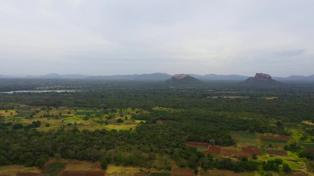 Aerial view of Sigiriya lion rock and Pidurangala in a mountain valley among green tropical vegetation. Sri Lanka.