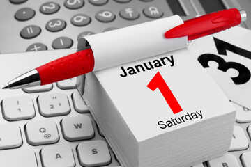 Calendar 2022 Saturday January 1 with PC keyboard and red pen