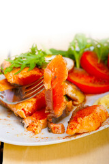 grilled samon filet with vegetables salad