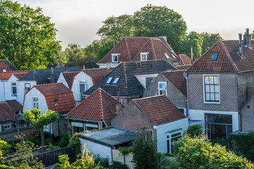 Walking in old Dutch town Zierikzee with old small houses and streets