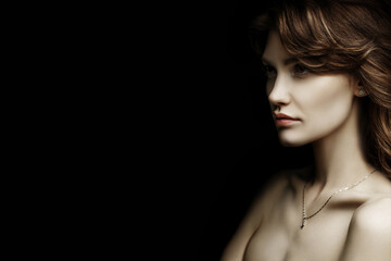 Portrait of a girl close-up. Beautiful red lips. Black background