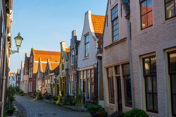 Walking in old Dutch town Zierikzee with old small houses and streets