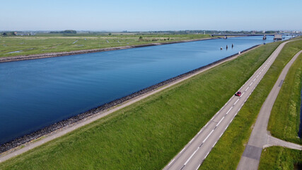 Aerial view on green polders, meadows and water transportion channel in South Beveland, Zeeland, Netherlands