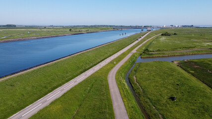 Aerial view on green polders, meadows and water transportion channel in South Beveland, Zeeland, Netherlands