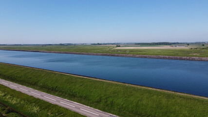 Aerial view on green polders, meadows and water transportion channel in South Beveland, Zeeland, Netherlands